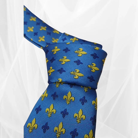 Blue silk tie with yellow and navy fleur-de-lis pattern, elegant men's fashion accessory